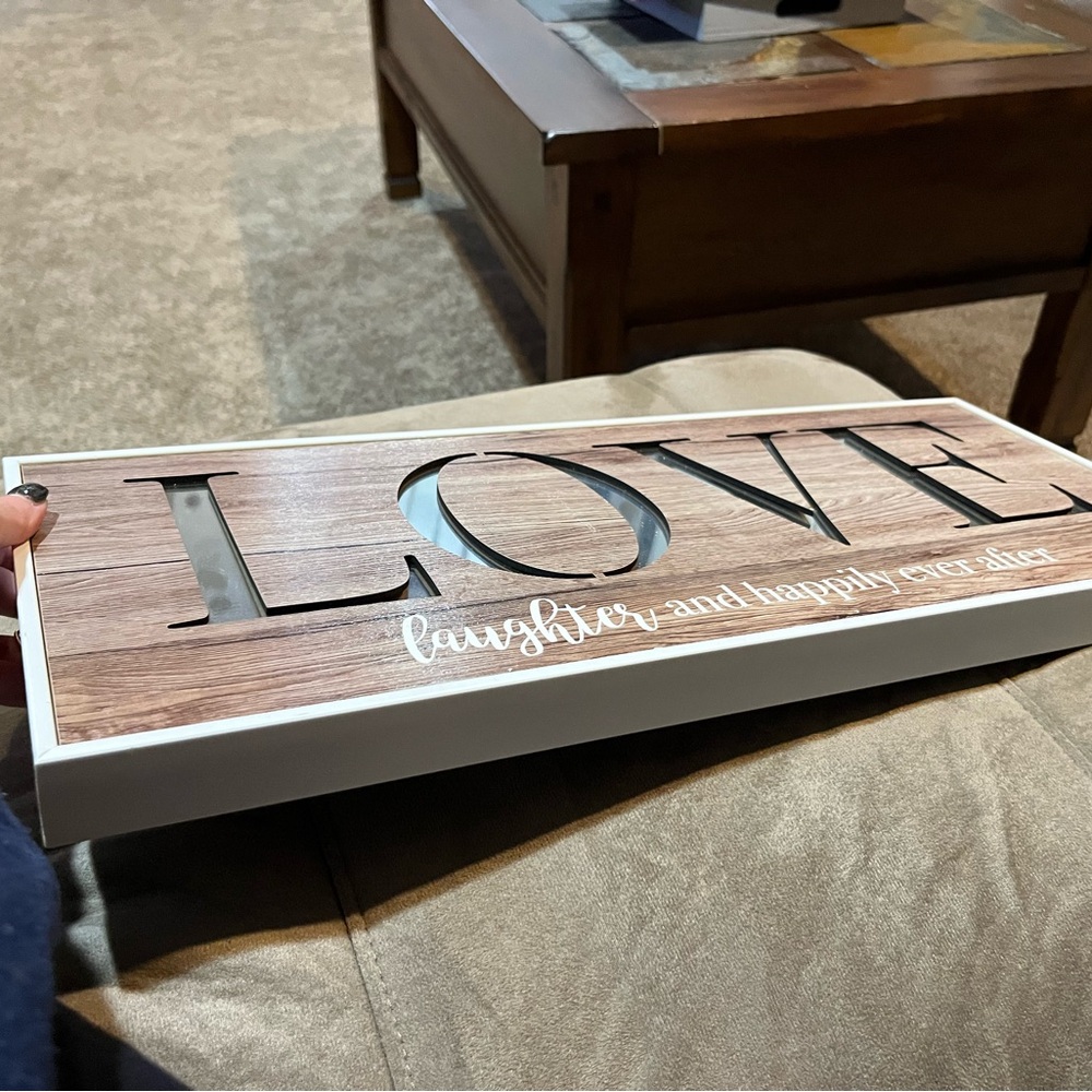 “Love Laughter and Happily Ever After” sign